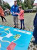 Na zdjęciu uczestnicy wielkoformatowej gry planszowej