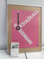 Zdjęcie przedstawia książkę i plakat